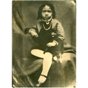 Show  The young Dr Du Bois at the age of four, dressed to conform to the Victorian Image