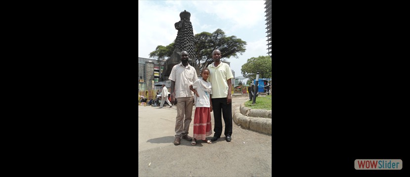 KAWA researcher posing with a street girl infront of the Ethiopian National theatre.