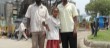 KAWA researcher posing with a street girl infront of the Ethiopian National theatre.